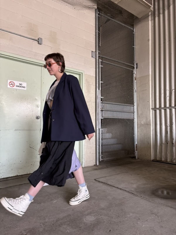 SADiE mid-step with a blazer and sunglasses on